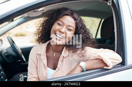 Black woman, car and smile of a relax person from Jamaica on a road trip with motor transport. Portrait of a happy and relax female in a vehicle Stock Photo