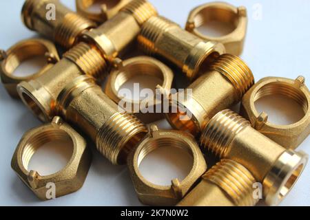 Set Of Male Brass Water Meter Fittings And Plumbing Nuts Detailed Angle View. Pipe And Tube Copper Connectors Isolated On White Stock Photo