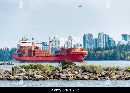 Container cargo liner in Vancouver harbor going fairway Stock Photo