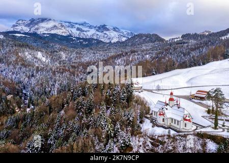 Hergiswald church, an important historical pilgrimage destination in Kriens, Switzerland, in the snow covered winter swiss Alps mountains Stock Photo