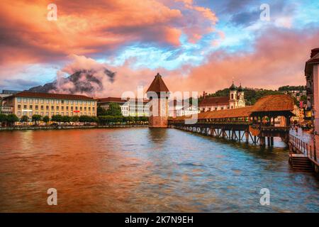 Dramatic sunset over Lucerne Old town, Switzerland, Lake Lucerne and Mount Pilatus in the swiss Alps mountains Stock Photo