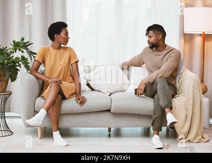 Were on the same team against this issue. a young couple having an argument at home. Stock Photo