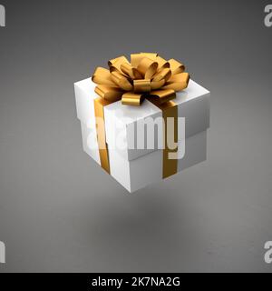 A white gift box with golden ribbon and bow hovering over a gray background. Stock Photo