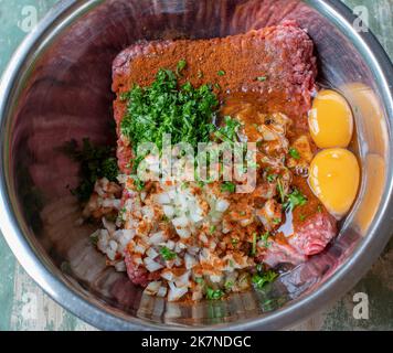 Meatball dough in a bowl Stock Photo