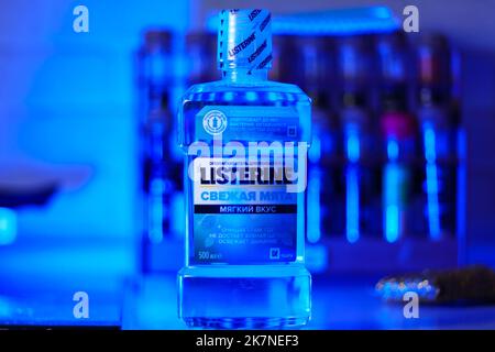 Tyumen, Russia-October 14, 2022: Listerine is a brand of antiseptic mouthwash product on blue background. Stock Photo