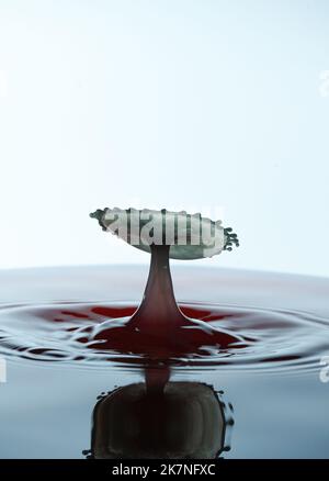 Splash of colorful water crown on the surface. Stock Photo