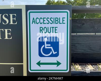A disabled accessible route sign on a street. Stock Photo