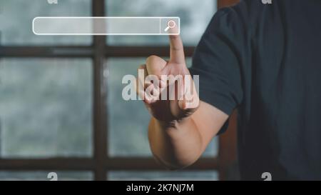 Hand of man touching searching browsing icon for internet data information networking. The blank search bar screen background, business and technology Stock Photo
