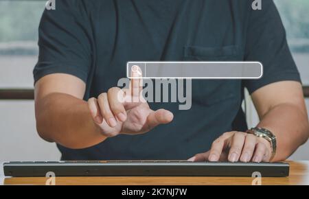 Hand of man touching searching browsing icon for internet data information networking. The blank search bar screen background, business and technology Stock Photo