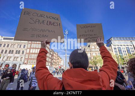 A man holds placards expressing his opinion, during the demonstration ...