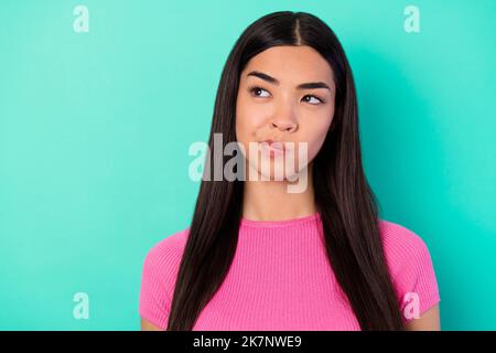 Photo of young pretty woman look empty space brainstorming create plan solution isolated on blue color background Stock Photo
