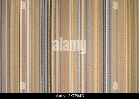 colorful earth tone fabric background with soft faded rainbow-colored vertical stripes Stock Photo