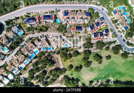 Aerial drone point of view modern suburban houses and surrounding meadows. Costa Blanca, Province of Alicante. Spain Stock Photo