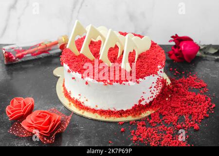 Red velvet cake, classic three layered cake from red butter sponge cakes with cream cheese frosting Stock Photo