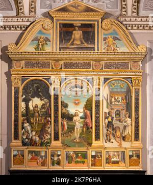 BELLANO, ITALY - JULY 20, 2022: The ranaissance painted altar of John Baptist in the church Chiesa dei santi Nazareo e Celso by unknown artist Stock Photo