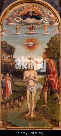 BELLANO, ITALY - JULY 20, 2022: The ranaissance painting of Baptism of Jesus in the church Chiesa dei santi Nazareo e Celso Stock Photo