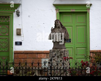 Jerico, Antioquia, Colombia - April 5 2022: Bust of the Merciful Jesus Carved in Stone at the Entrance of the Village Parish Church Stock Photo