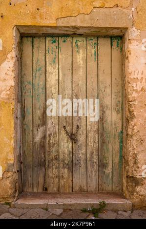 Old, rotting door in stone house in Galatina old town, Apulia (Puglia), Italy Stock Photo