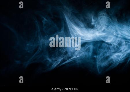 Blue Abstract atmospheric smoke cloud. Fog haze on dark background. Stock Photo