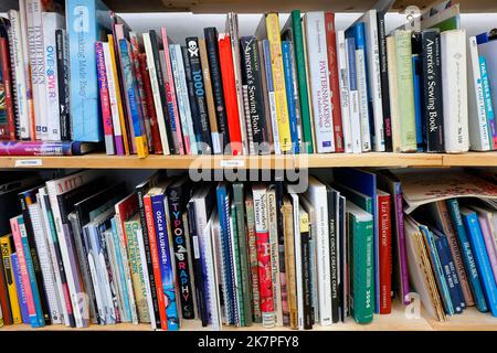 A selection of books on sewing, patterns, textile and fiber arts at the Textile Arts Center, Brooklyn. Stock Photo