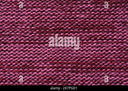 Purple melange woolen knitted fabric texture. Macro. Stock Photo