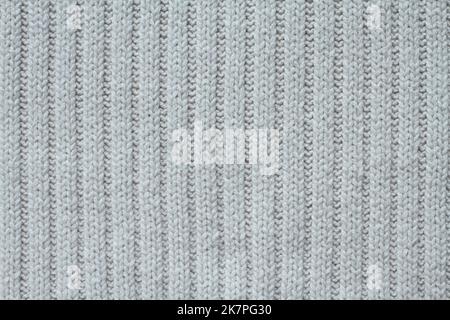 Light beige cotton knitted fabric texture. Macro. Stock Photo