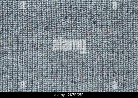 Light gray woolen knitted fabric texture. Macro. Stock Photo