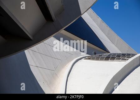 A worker on a low roof at the Olympic Stadium in Montreal, Quebec, Canada Stock Photo