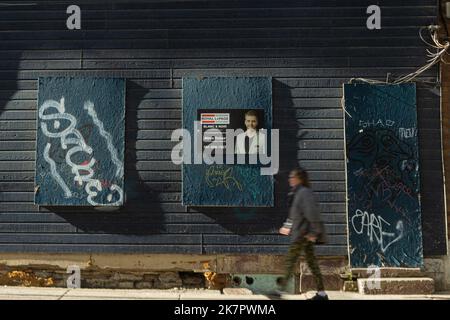 A woman walks by a decaying building in the Quebec city district of St-Roch on September 16, 2022. Stock Photo