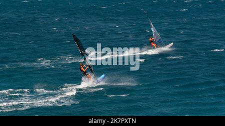 Agios Nikolaos, Crete, Greece. 2022. Wind surfers off the coast of Agios Nikolaos. Stock Photo
