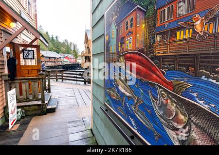 'Creek Street Life' Mural by Artist Ray Troll in Historic Creek Street in Ketchikan, Alaska, USA Stock Photo