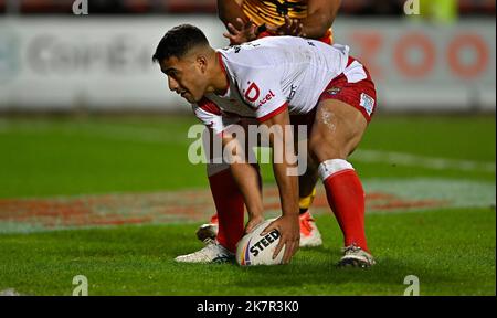 Tonga's Will Penisini (left) and Cook Islands' Kayal Iro in action