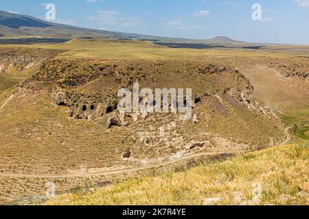 Tsaghkotsadzor (Alaca cay) valley with man-made caves next to the ancient city Ani, Turkey Stock Photo