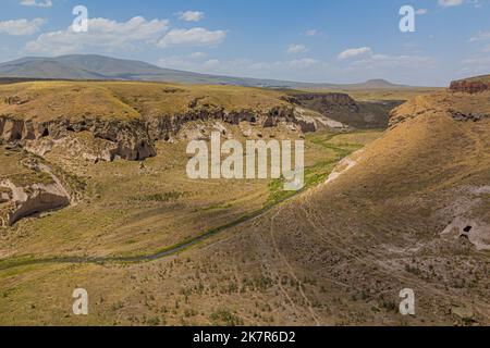 Tsaghkotsadzor (Alaca cay) valley with man-made caves next to the ancient city Ani, Turkey Stock Photo