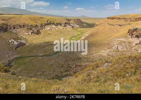 Tsaghkotsadzor (Alaca cay) valley with man-made caves next to the ancient city Ani, Turkey Stock Photo