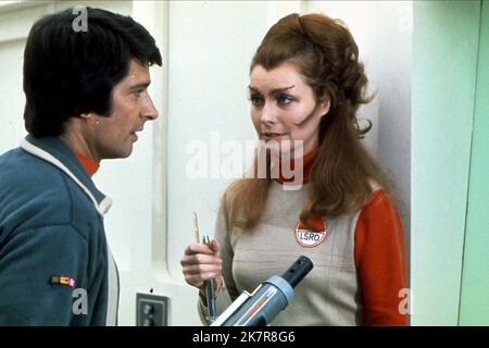 Tony Anholt & Catherine Schell Television: Space 1999 ; Space: 1999 (1975) Characters: Tony Verdeschi, Maya  Director: Gerry Anderson & Silvia Anderson 04 September 1975   **WARNING** This Photograph is for editorial use only and is the copyright of CBSFOX and/or the Photographer assigned by the Film or Production Company and can only be reproduced by publications in conjunction with the promotion of the above Film. A Mandatory Credit To CBSFOX is required. The Photographer should also be credited when known. No commercial use can be granted without written authority from the Film Company. Stock Photo