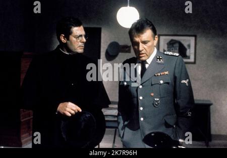 Marcello Mastroianni & Richard Burton Film: Massacre In Rome; Rappresaglia (1971) Characters: Father Pietro Antonelli, Lt. Col. Herbert Kappler  Director: George P. Cosmatos 04 October 1973   **WARNING** This Photograph is for editorial use only and is the copyright of FIDUCIARY and/or the Photographer assigned by the Film or Production Company and can only be reproduced by publications in conjunction with the promotion of the above Film. A Mandatory Credit To FIDUCIARY is required. The Photographer should also be credited when known. No commercial use can be granted without written authority Stock Photo