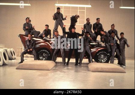 John Travolta  Film Grease (USA 1978) Characters: Danny Zuko  / 1948 Ford 'Greased Lightning' Director: Randal Kleiser 13 June 1978   **WARNING** This Photograph is for editorial use only and is the copyright of PARAMOUNT PICTURES and/or the Photographer assigned by the  Film or Production Company and can only be reproduced by publications in conjunction with the promotion of the above  Film. A Mandatory Credit To PARAMOUNT PICTURES is required. The Photographer should also be credited when known. No commercial use can be granted without written authority from the  Film Company. Stock Photo