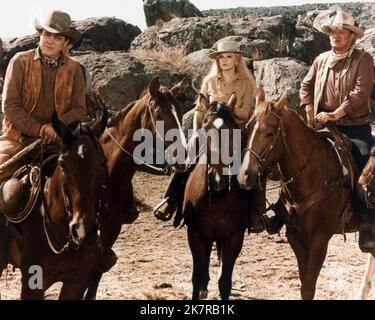 Ben Johnson, Ann-Margret & John Wayne Film: The Train Robbers (USA 1973) Characters: Jesse,Mrs. Lowe & Lane  Director: Burt Kennedy 07 February 1973   **WARNING** This Photograph is for editorial use only and is the copyright of BATJAC PRODUCTIONS and/or the Photographer assigned by the Film or Production Company and can only be reproduced by publications in conjunction with the promotion of the above Film. A Mandatory Credit To BATJAC PRODUCTIONS is required. The Photographer should also be credited when known. No commercial use can be granted without written authority from the Film Company. Stock Photo