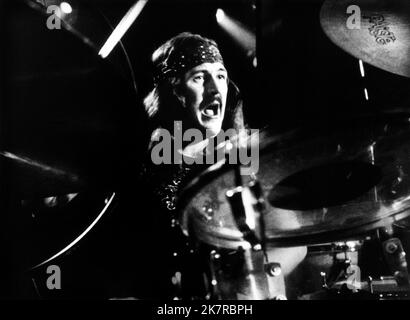 John Bonham Film: The Song Remains The Same (1979) Characters: Himself - Drummer (as Led Zeppelin)  Director: Peter Clifton & Joe Massot 20 October 1976   **WARNING** This Photograph is for editorial use only and is the copyright of WARNER BROS and/or the Photographer assigned by the Film or Production Company and can only be reproduced by publications in conjunction with the promotion of the above Film. A Mandatory Credit To WARNER BROS is required. The Photographer should also be credited when known. No commercial use can be granted without written authority from the Film Company. Stock Photo