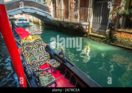 Ornate Gondola in peaceful Canal corner at sunny day, Venice, Italy Stock Photo