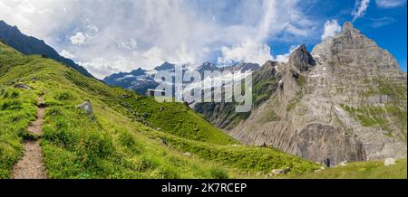 The massif of Grosses Fiescher horn peak and Berghaus Baregg chalet - Switzerland - Grindelwald. Stock Photo