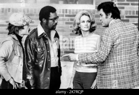 Charles Dierkop, Ed Bernard & Earl Holliman Film: Police Woman (1974) Characters: Det. Pete Royster, Det. Joe Styles, Lt. Bill Crowley  Director: Jack Hanrahan 13 September 1974   **WARNING** This Photograph is for editorial use only and is the copyright of COLUMBIA and/or the Photographer assigned by the Film or Production Company and can only be reproduced by publications in conjunction with the promotion of the above Film. A Mandatory Credit To COLUMBIA is required. The Photographer should also be credited when known. No commercial use can be granted without written authority from the Film Stock Photo