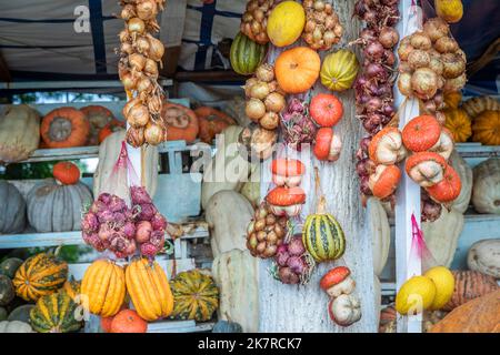 Watermelons, onions and melons are sold in market on the side of the road Stock Photo