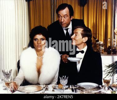 Suzanne Danielle, Jack Douglas & Kenneth Williams Film: Carry On Emmanuelle (UK 1978) Characters: Emmannuelle Prevert,Lyons & Emile Prevert  Director: Gerald Thomas 12 October 1978   **WARNING** This Photograph is for editorial use only and is the copyright of RANK FILM and/or the Photographer assigned by the Film or Production Company and can only be reproduced by publications in conjunction with the promotion of the above Film. A Mandatory Credit To RANK FILM is required. The Photographer should also be credited when known. No commercial use can be granted without written authority from the Stock Photo