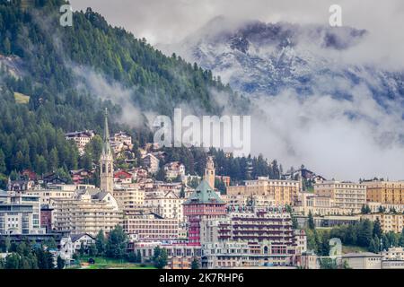 St Moritz cityscape under mountain mist, Engadine, Swiss alps, Switzerland Stock Photo