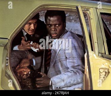 Sidney Poitier Film: The Organization (1977) Characters: Detective Lieutenant Virgil Tibbs SFPD Homicide  Director: Don Medford 20 October 1971   **WARNING** This Photograph is for editorial use only and is the copyright of METRO-GOLDWYN-MAYER and/or the Photographer assigned by the Film or Production Company and can only be reproduced by publications in conjunction with the promotion of the above Film. A Mandatory Credit To METRO-GOLDWYN-MAYER is required. The Photographer should also be credited when known. No commercial use can be granted without written authority from the Film Company. Stock Photo