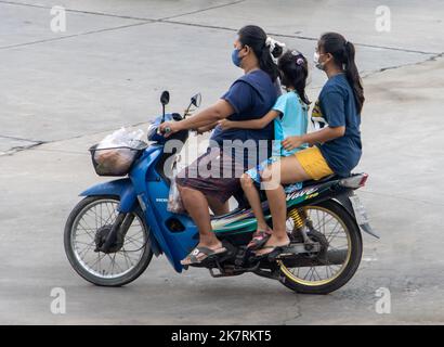 SAMUT PRAKAN, THAILAND, SEP 23 2022, A group of female persons ride a motorcycle Stock Photo