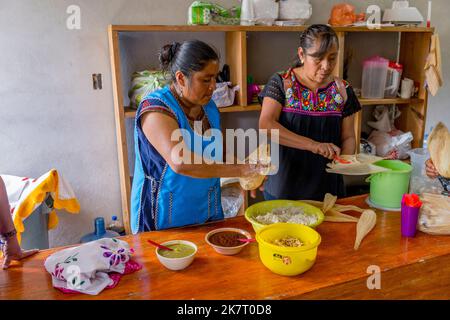 Women making Tamales in the Mixtec village of San Jose Contreras near Oaxaca City, Mexico. Stock Photo