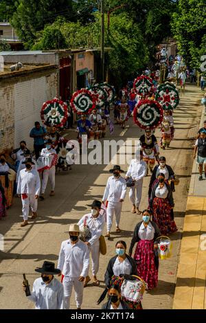 View of the Parade of Delegations to the Guelaguetza in the streets of San Antonino Castillo Velasco near Oaxaca, Mexico. Stock Photo